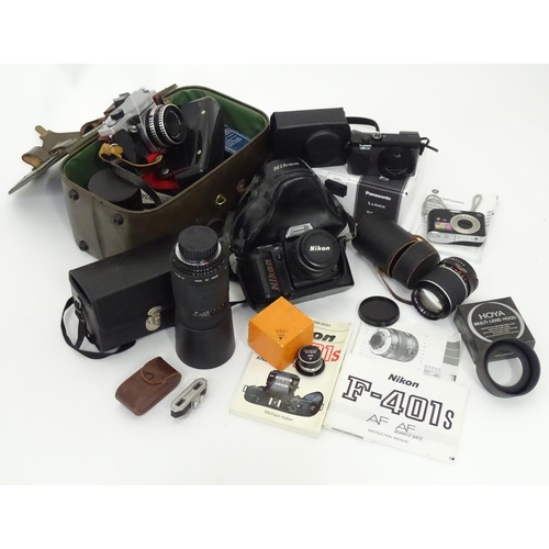 93 - A quantity of film and digital cameras to include a cased Nikon F-401s camera, a cased Pentacon Prak... 