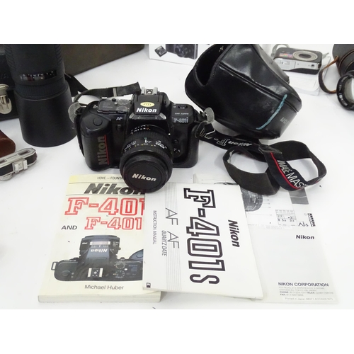 93 - A quantity of film and digital cameras to include a cased Nikon F-401s camera, a cased Pentacon Prak... 