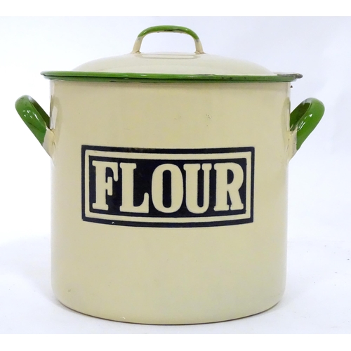 107 - A flour tin with enamel detail. Approx 9