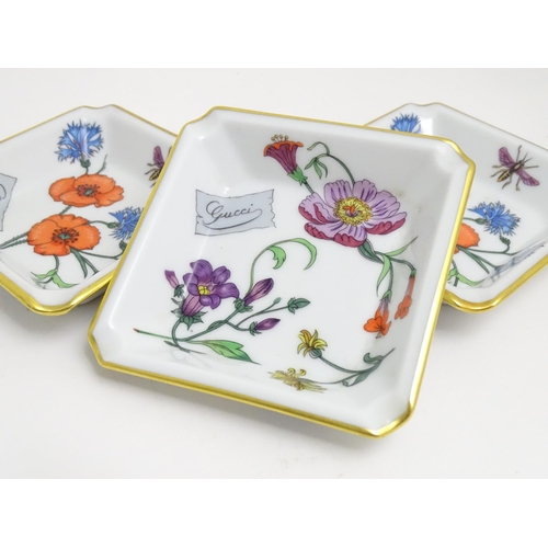 40 - Three Limoges ceramic pin dishes / ashtrays of square form decorated with flowers marked Gucci. Mark... 