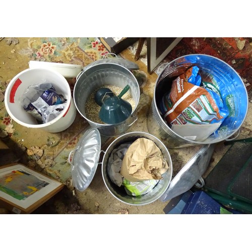 971 - Three galvanised dustbins together with a quantity of bird food