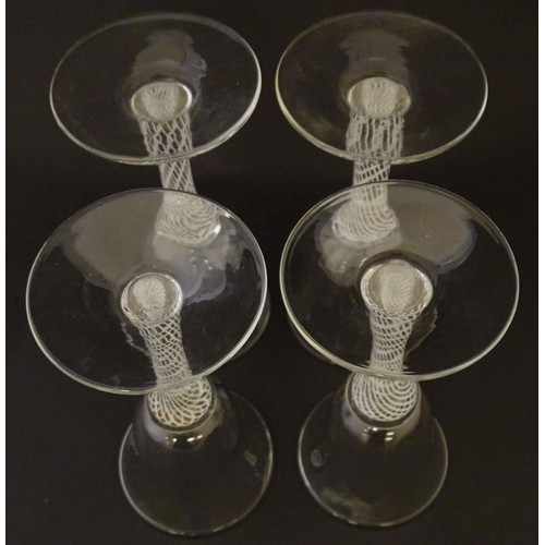 279 - Four various drinking glasses with coloured twist decoration to stems Tallest approx 7 1/4