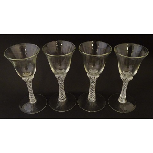 279 - Four various drinking glasses with coloured twist decoration to stems Tallest approx 7 1/4