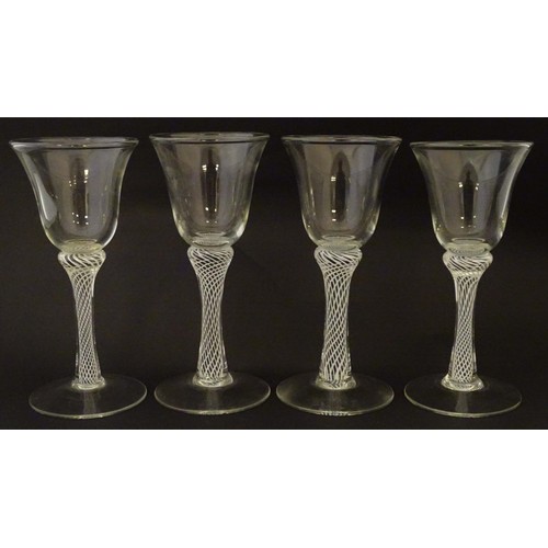 279 - Four various drinking glasses with coloured twist decoration to stems Tallest approx 7 1/4