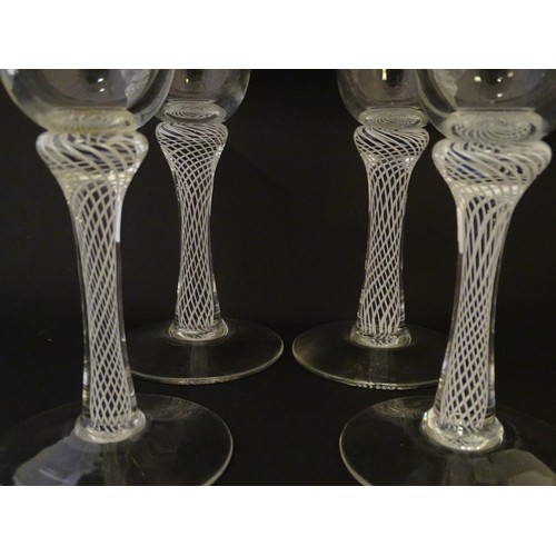 279 - Four various drinking glasses with coloured twist decoration to stems Tallest approx 7 1/4