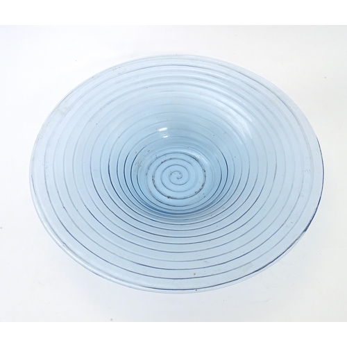 309 - A pale blue glass bowl with swirl detail. Approx 19