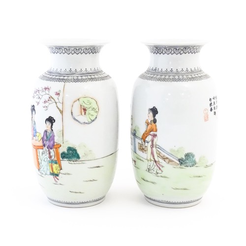 2 - A pair of Japanese vases decorated with female figures in a garden landscape, three ladies seated un... 