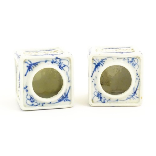 13 - Two Chinese ink pot stands of squared form with reticulated sides and blue brushwork detail. Approx.... 