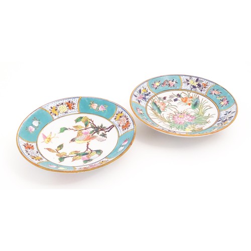 33 - Two Oriental dishes, one decorated with a bird perched on a peach branch with a butterfly, the turqu... 