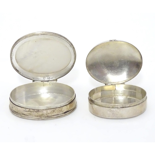 532 - A silver pill box of oval form Hallmarked Sheffield 1998 together with a .925 silver pill box with m... 