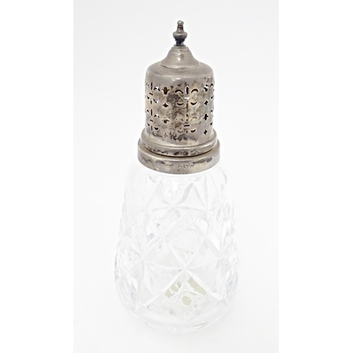 540 - A Tudor Crystal cut glass sugar caster with silver top, hallmarked Birmingham 1986, maker W. I. Broa... 