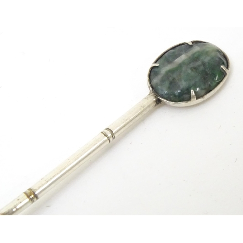 591 - A set of six Oriental style teaspoons with carved jade style detail to handle. Approx. 4 3/4