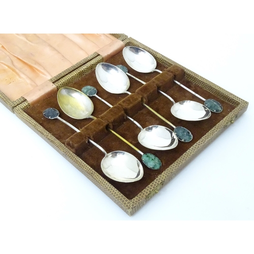 591 - A set of six Oriental style teaspoons with carved jade style detail to handle. Approx. 4 3/4