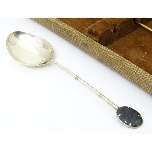 591 - A set of six Oriental style teaspoons with carved jade style detail to handle. Approx. 4 3/4