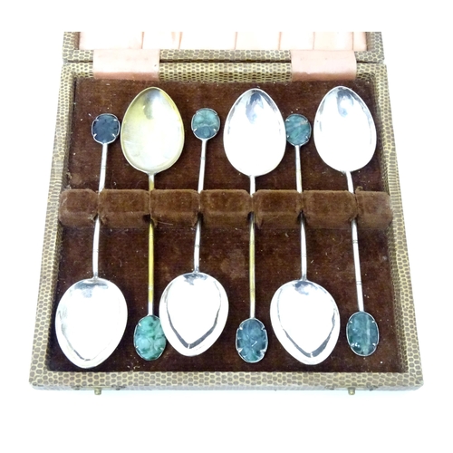 591 - A set of six Oriental style teaspoons with carved jade style detail to handle. Approx. 4 3/4