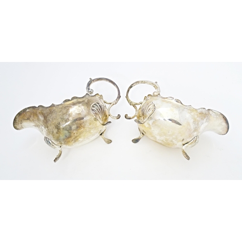 605 - A pair of Victorian silver plate sauce boats. Approx. 8 3/4