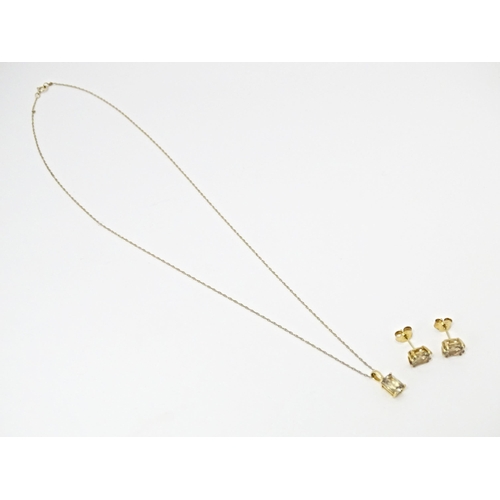 759 - A 9ct gold pendant set with csarite, together with a pair of matching stud earrings. The pendant on ... 