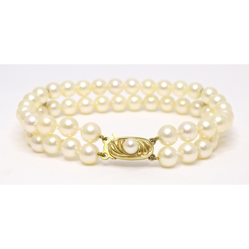 764 - A two strand pearl bracelet with 9ct gold clasp. Approx 7 1/2