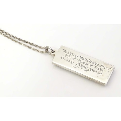 765 - A silver Charles and Diana commemorative / souvenir pendant of ingot form hallmarked Sheffield 1981,... 