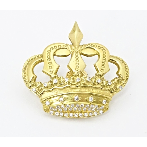 766 - A Continental 18ct gold badge / pin of crown form set with diamonds. Approx. 1 1/4