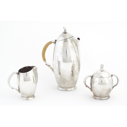 1095 - A 20thC three piece silver plate coffee set by Rogers Bros. in the pattern Flair, comprising coffee ... 