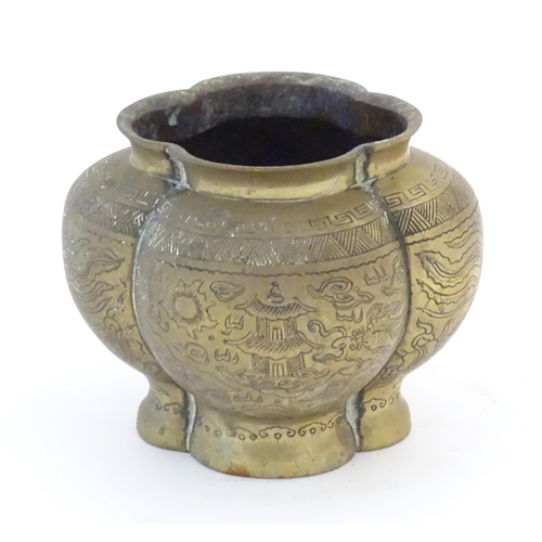 1127 - A Chinese brass lobed pot decorated with dragons, phoenix birds and pagoda buildings. Character mark... 