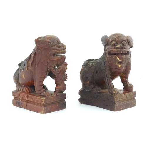 1144 - Two Chinese carved wooden foo dogs / guardian lions, one with a cub, the other with a ball, with tra... 