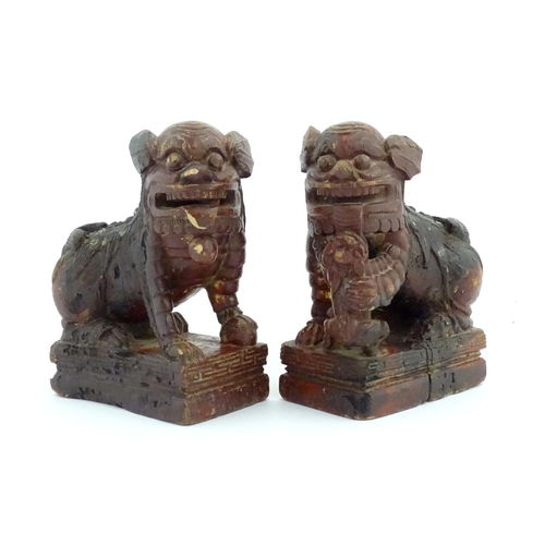 1144 - Two Chinese carved wooden foo dogs / guardian lions, one with a cub, the other with a ball, with tra... 