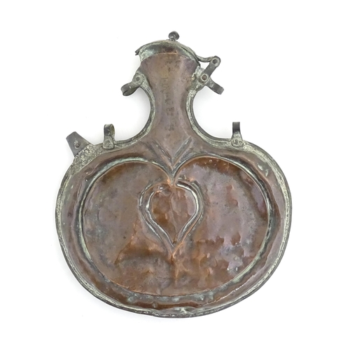 1149 - A large late 19thC Welsh copper flask by Pascoe Grenfell & Sons with stylised heart detail. Impresse... 