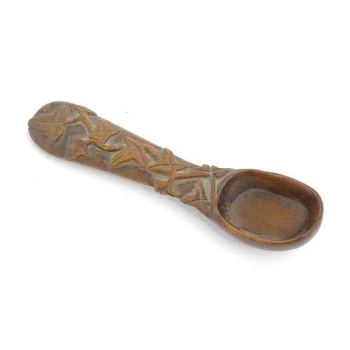 1165 - A Victorian carved wooden treen spoon with stylised vine leaf decoration, signed J. J. 1889 under. A... 