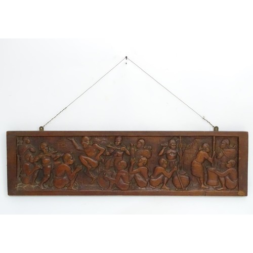 1181 - Ethnographic, Native, Tribal : A 20thC carved hardwood panel by Joseph Rasola depicting figures danc... 