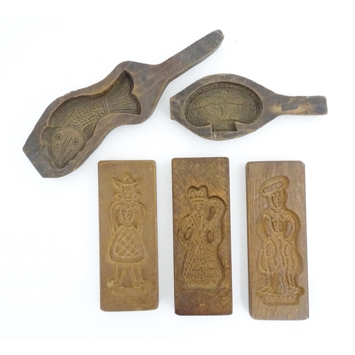 1193 - Five 19thC and later biscuit / shortbread moulds decoration to include fish, vase, figures, etc. Lar... 