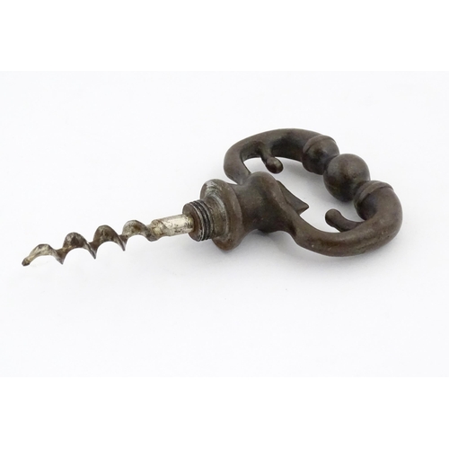 1195 - A 20thC novelty corkscrew / bottle opener modelled as an old key, titled The Key to Happiness. In or... 