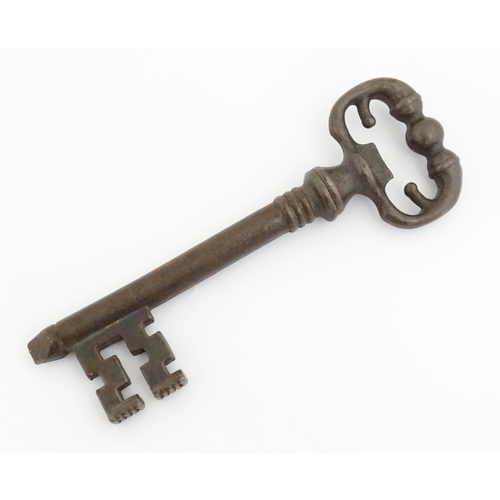 1195 - A 20thC novelty corkscrew / bottle opener modelled as an old key, titled The Key to Happiness. In or... 