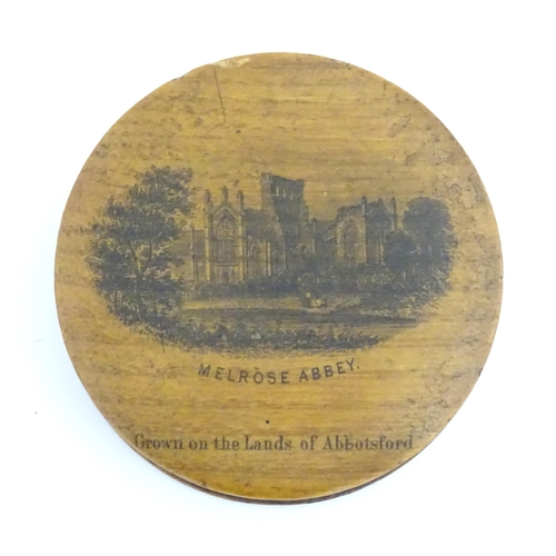 1272 - A 19thC Mauchline ware pot of circular form depicting Melrose Abbey. Approx. 2 1/2