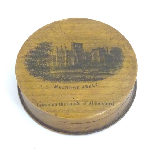 1272 - A 19thC Mauchline ware pot of circular form depicting Melrose Abbey. Approx. 2 1/2