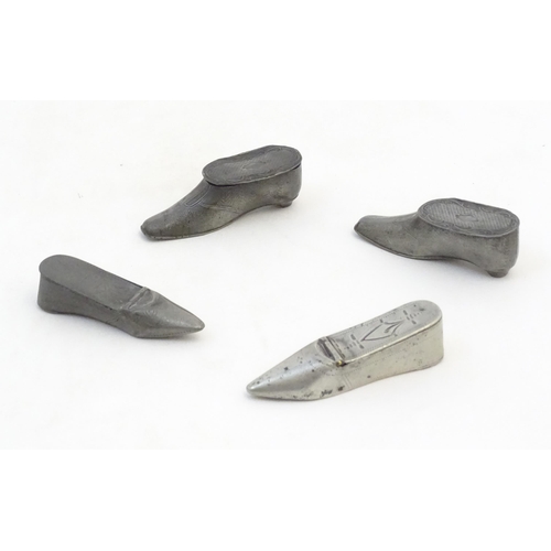 1279 - Four 19thC pewter snuff boxes modelled as shoes. Largest approx. 3 1/2