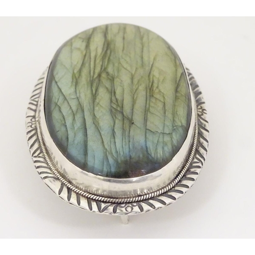 1285 - A buckle set with large labradorite style cabochon to centre. 3 1/4