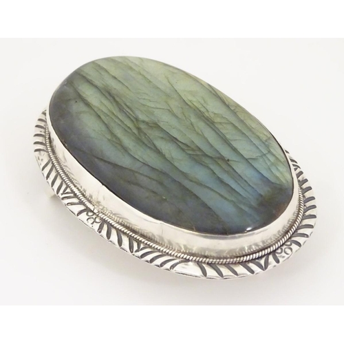 1285 - A buckle set with large labradorite style cabochon to centre. 3 1/4