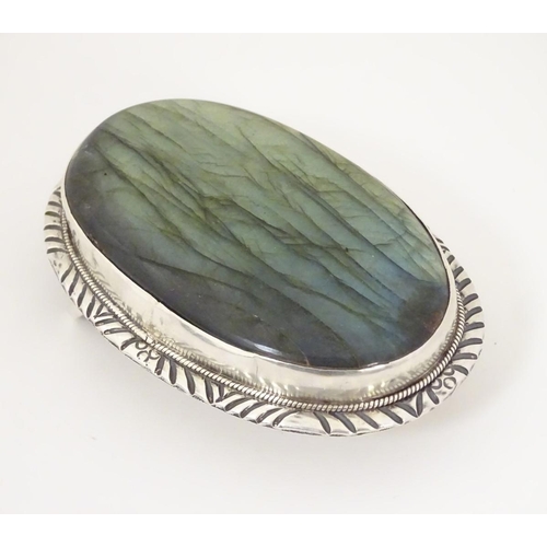 1285 - A buckle set with large labradorite style cabochon to centre. 3 1/4