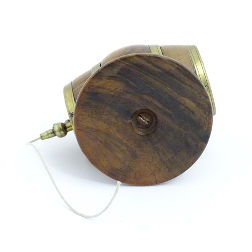 1298 - A 19thC carved walnut / treen string box modelled as a barrel with brass mounts and tap. Approx. 3