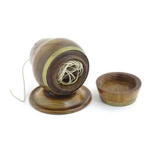 1298 - A 19thC carved walnut / treen string box modelled as a barrel with brass mounts and tap. Approx. 3