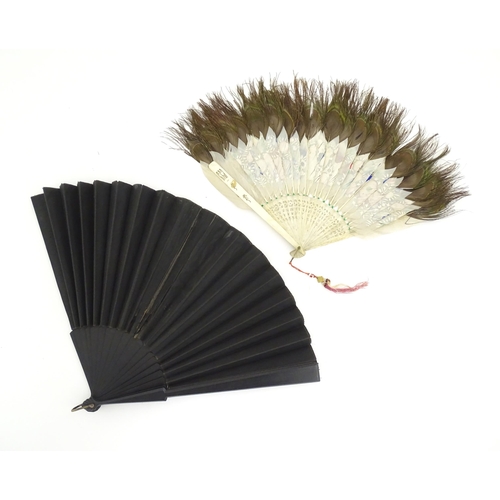 1299 - Two early 20thC fans, one bone with peacock feather detail, the other ebonised with needlework and p... 