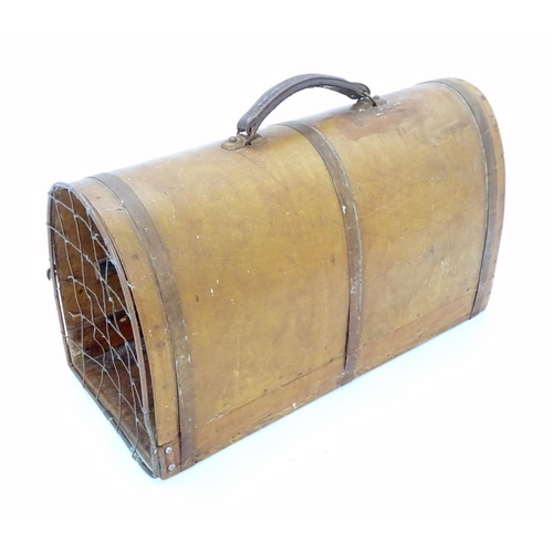 1313 - An early to mid 20thC pet carrier, of bentwood construction with cage door and leather handle. Appro... 