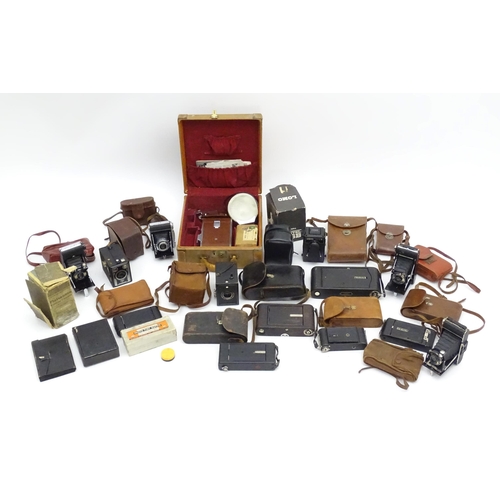 1248A - A quantity of 20thC cameras to include a Polaroid Land Camera model 95A with box and accessories, fl... 