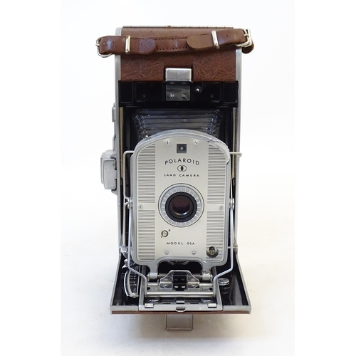 1248A - A quantity of 20thC cameras to include a Polaroid Land Camera model 95A with box and accessories, fl... 