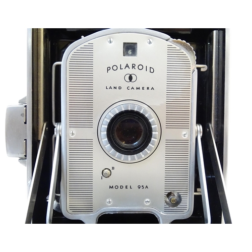 1248A - A quantity of 20thC cameras to include a Polaroid Land Camera model 95A with box and accessories, fl... 