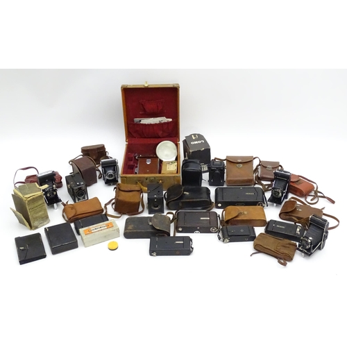 1248A - A quantity of 20thC cameras to include a Polaroid Land Camera model 95A with box and accessories, fl... 