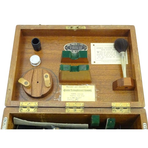 1361 - A surveyor's level theodolite by Cooke Troughton and Simms in original fitted box with instruction m... 