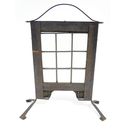 1365 - An Arts & Crafts fire screen with embossed foliate copper surround and nine glass panels to centre. ... 